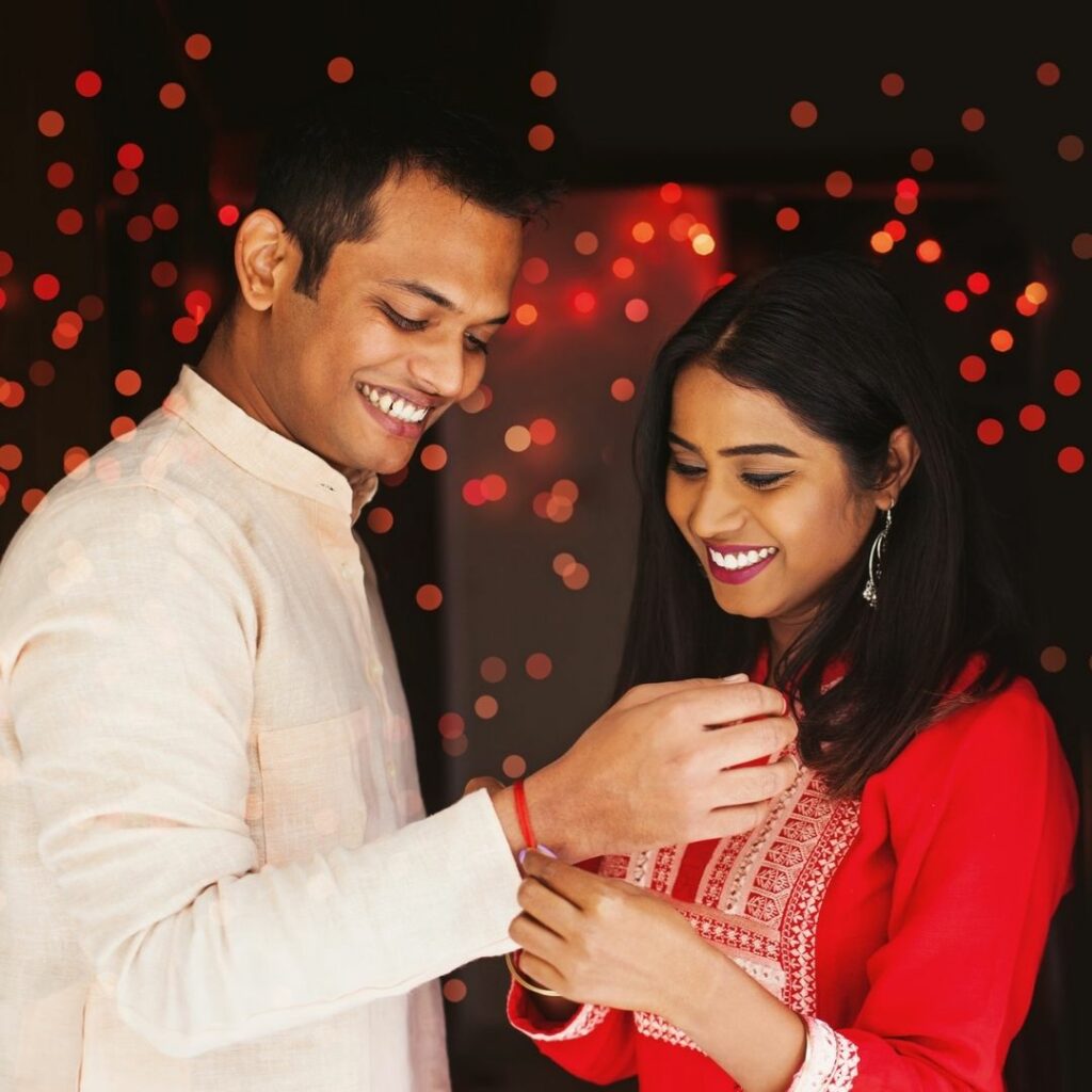 Sister tying rakhi on Brother's wrist